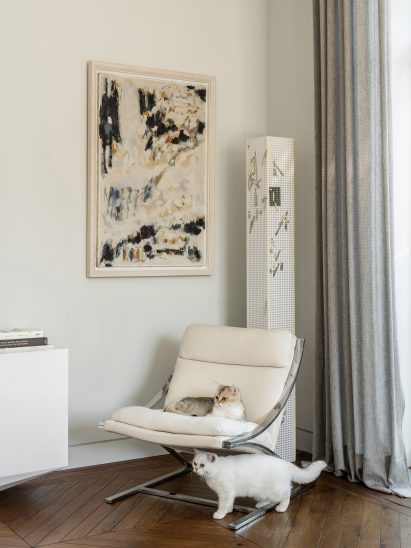 Cats on a Barcelona chair in an interior by Blockstudio