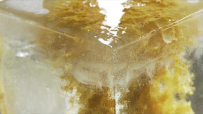 Close-up of 64 candle in an ice block