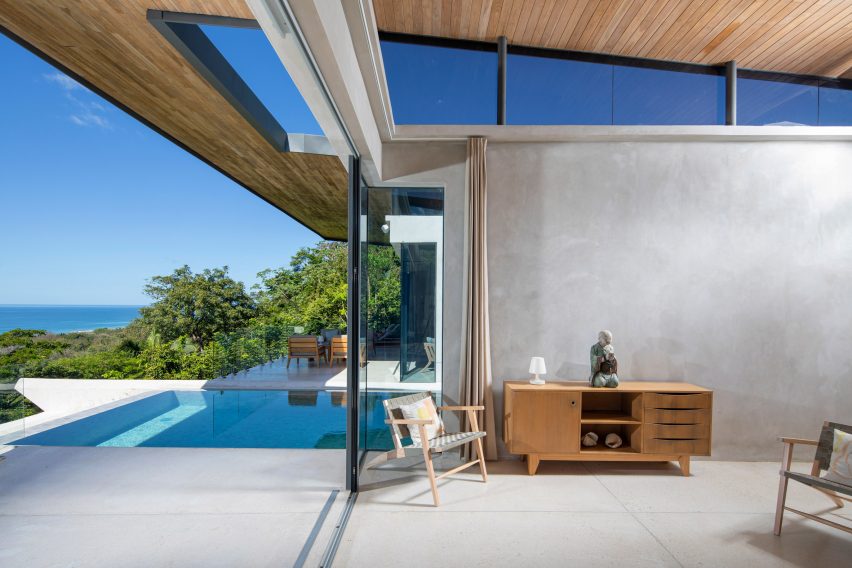 A swimming pool has sea views