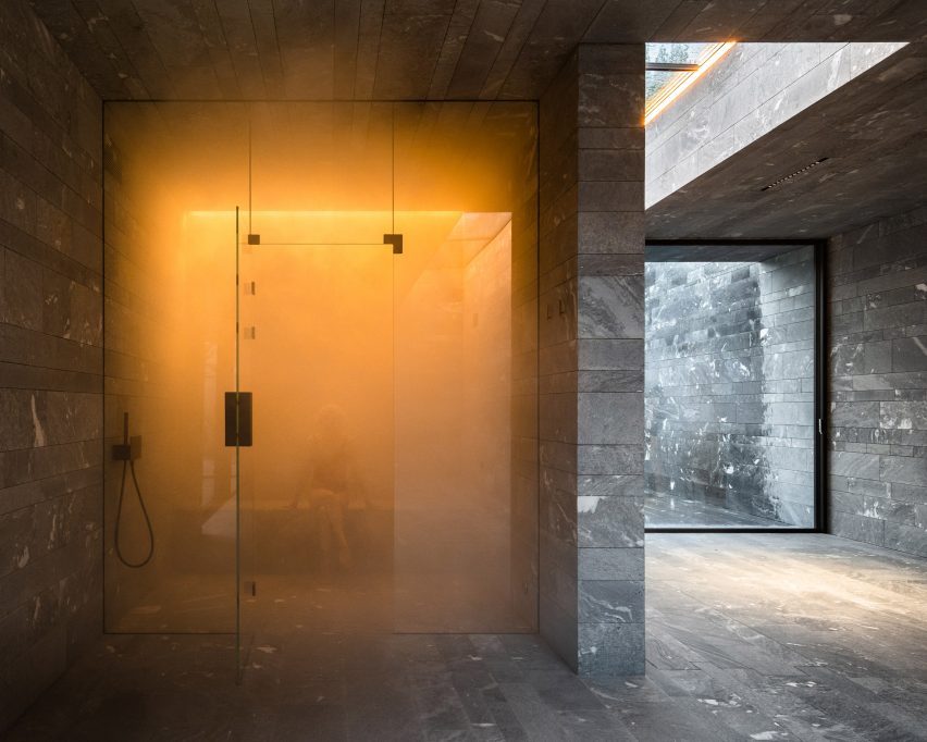 A sauna inside a private stone-walled spa