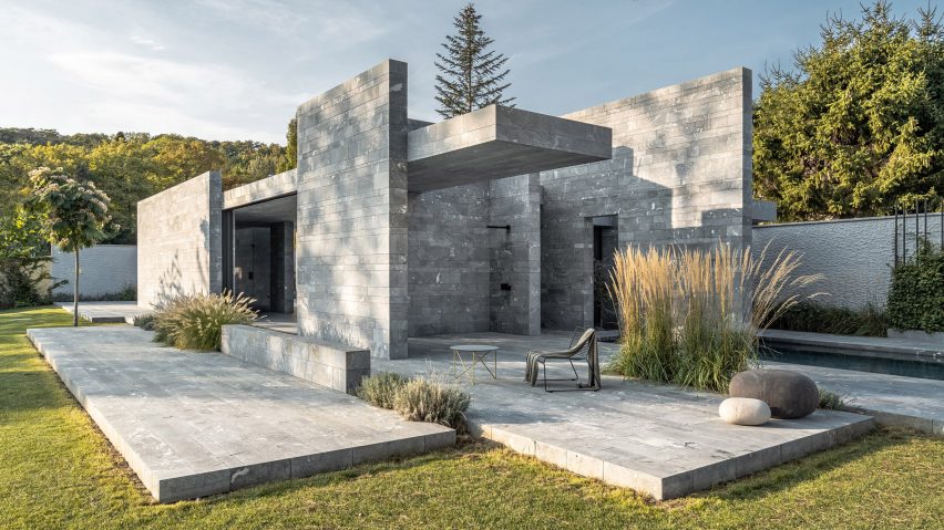 A monolithic private spa made from blocks of stone