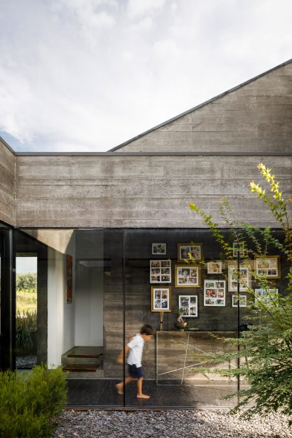 The glass-walled corridor of the Cork Oak House in Portugal
