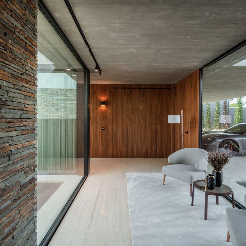 Hallway with white carpet and wood panelling