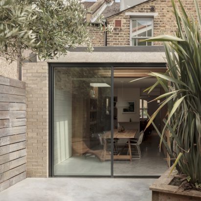 A small light-brick residential extension