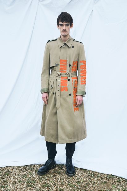 Algae-coated trench with orange slogan