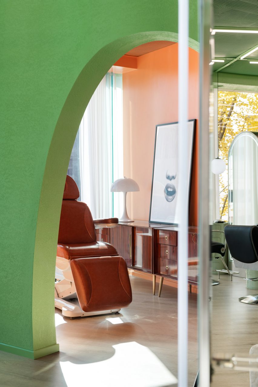 Orange walls zone the private treatment spaces