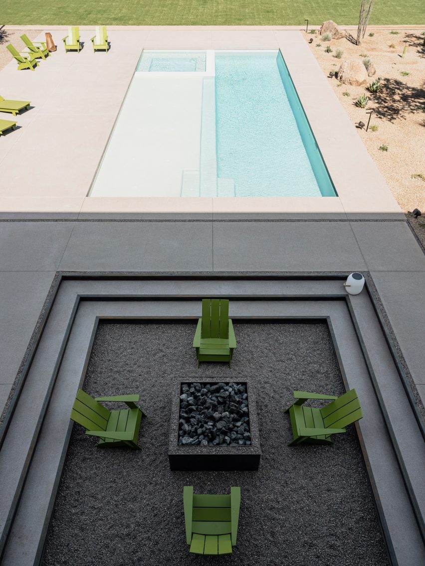 The fire pit next to the swimming pool