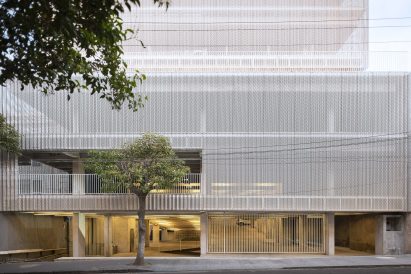 Perforated metal screen over a car park in Mexico