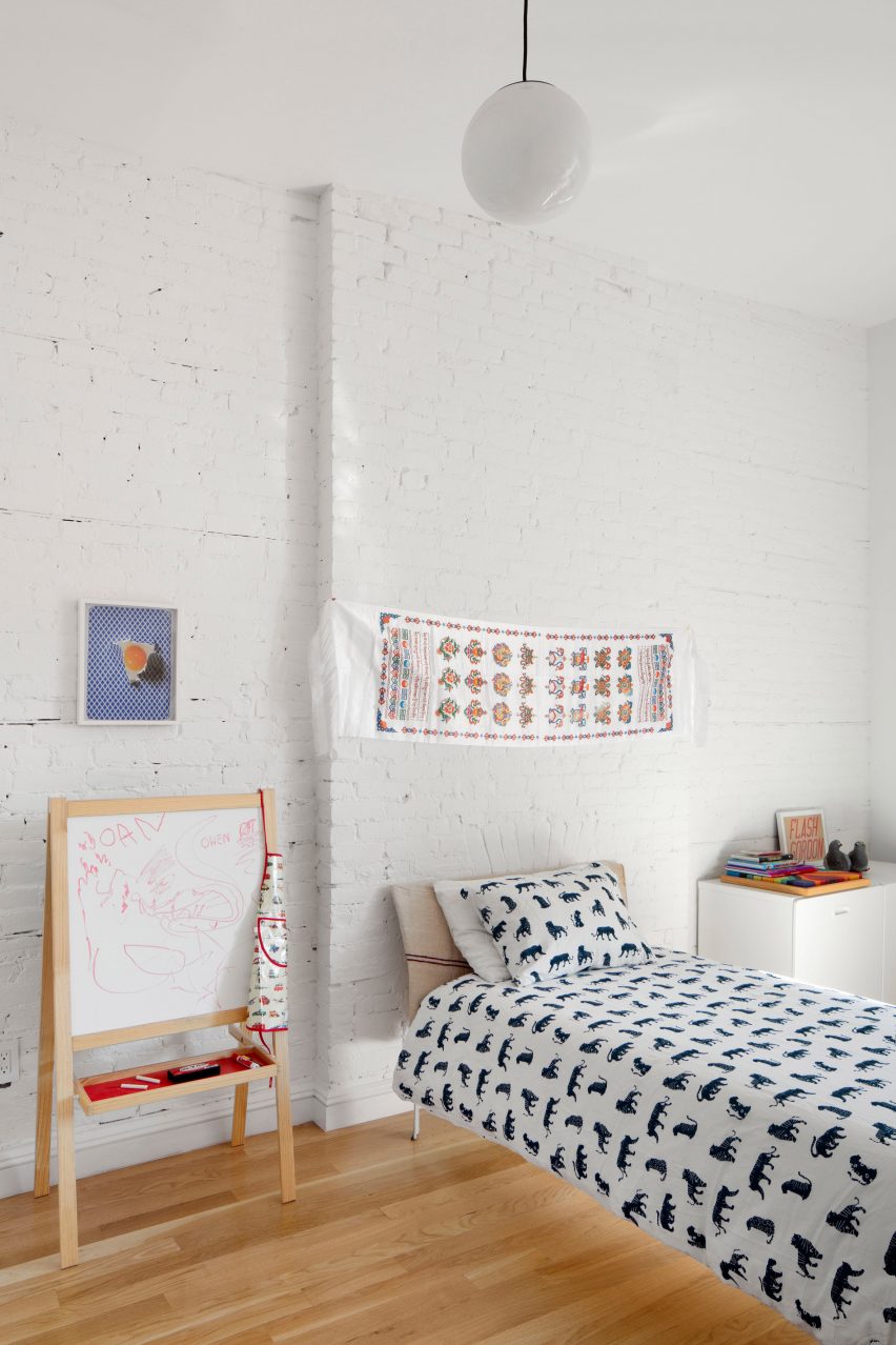 The children's bedroom with exposed brick walls