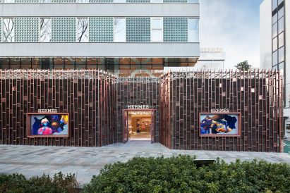 A gridded steel facade of a Japanese shop 