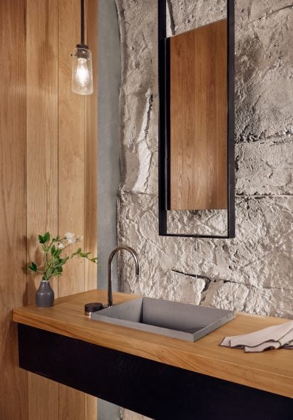 Bathroom with sprayed concrete walls in a Texas wine cellar