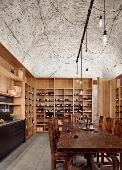 Wine cellar with vaulted concrete ceilings by Clayton Korte