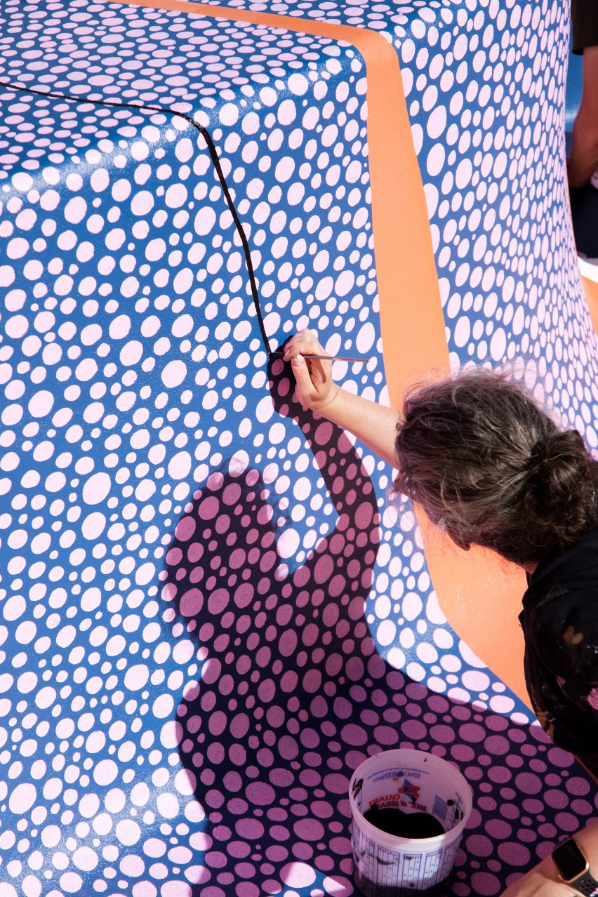 Alex Proba painting speckled details at Hill House