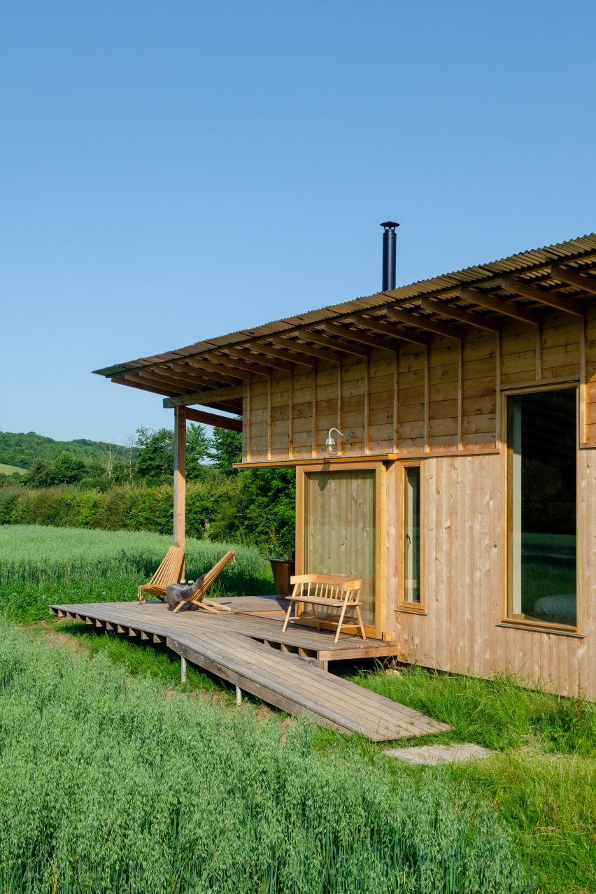 A wooden cabin with a sheltered veranda on a farm in England