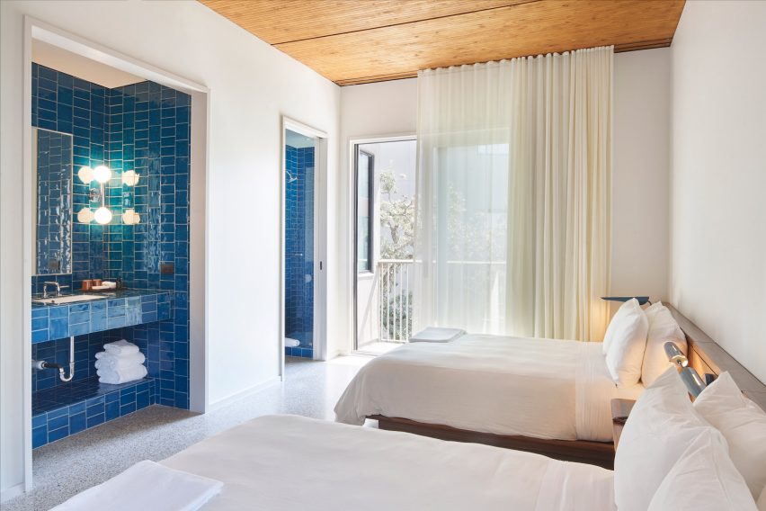 A blue tiled guest room