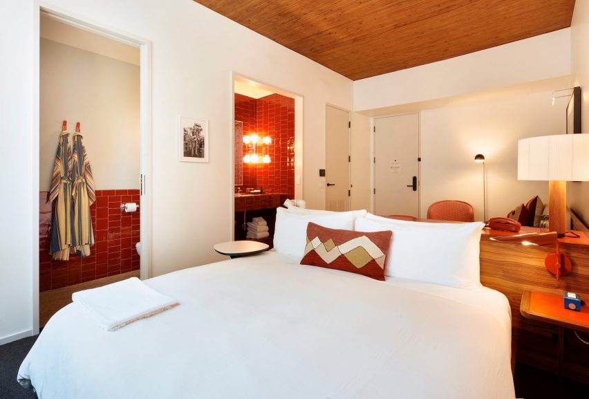Hippie textiles in a red tiled guest room