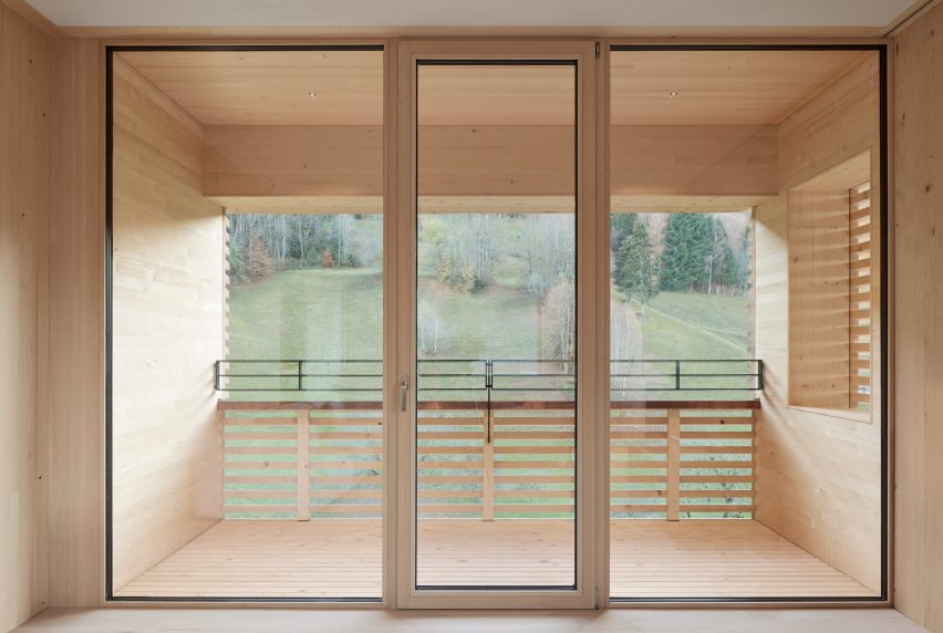 The view out of a wood-clad house by Firm Architekten