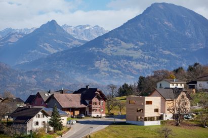 Austrian houses surrounded by Alpine landscape