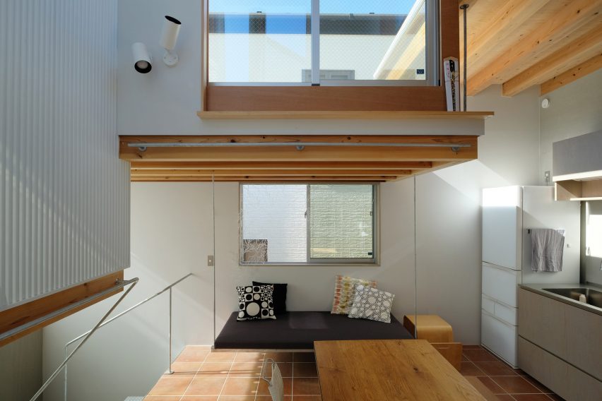 First floor with wooden table and large windows