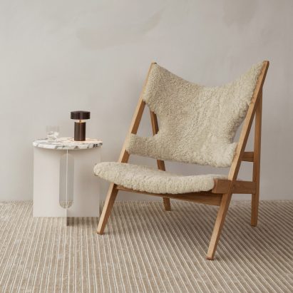 Knitting lounge chair with an oak frame and sheepskin upholstery