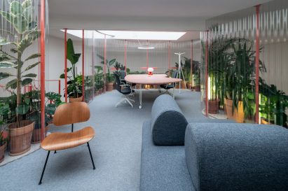 Mezzanine workspace area wrapped in transparent corrugated plastic in Grounds Coffee Hub