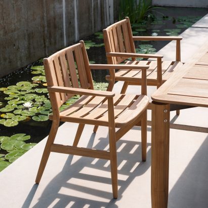 A pair of wooden outdoor dining chairs by Piero Lissoni