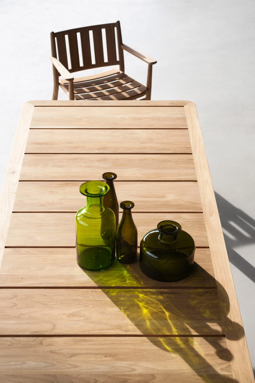 An outdoor dining table with a matching chair