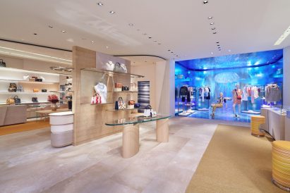Textured walls and stone floors fill the store