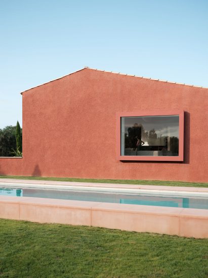 The red-coloured facade of a holiday home in Mallorca