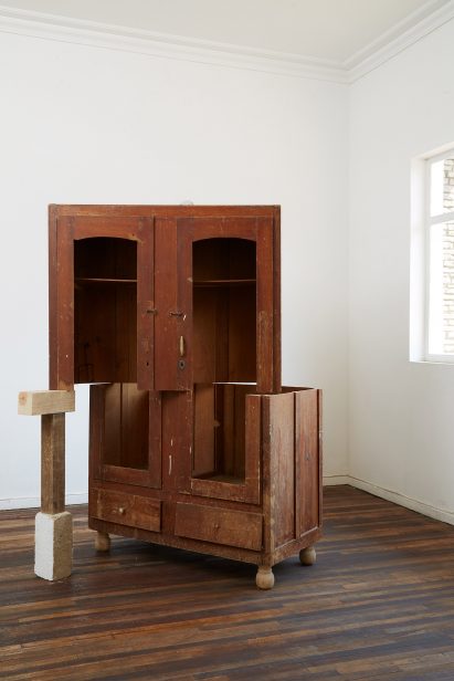 A fractured wooden cupboard