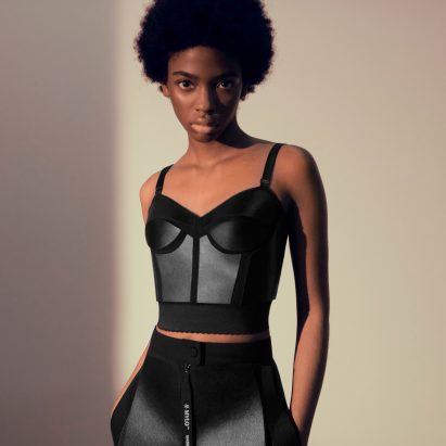 Model wearing black two-piece created by Stella McCartney from Mylo mycelium leather