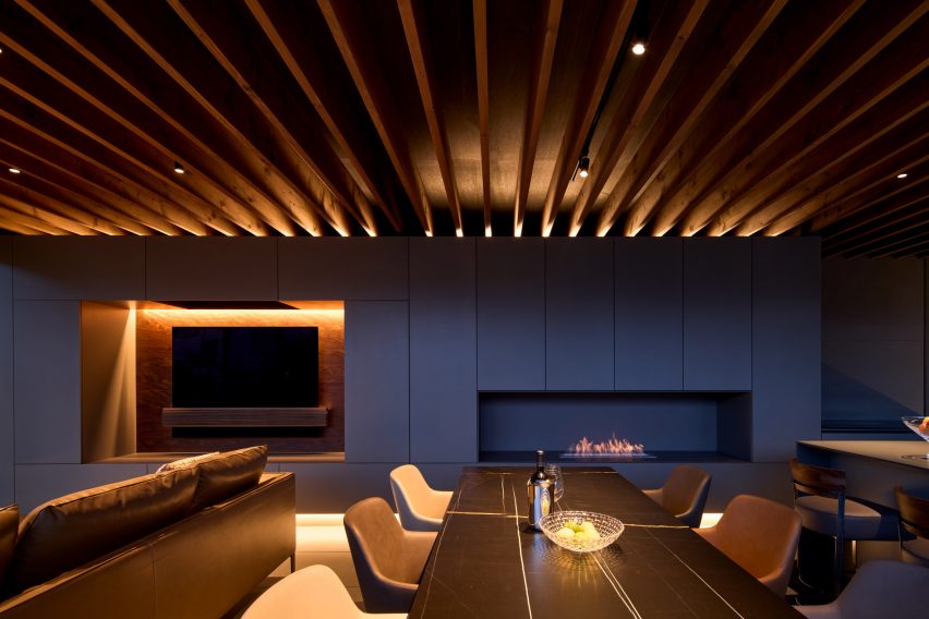 A fireplace is recessed into the wall
