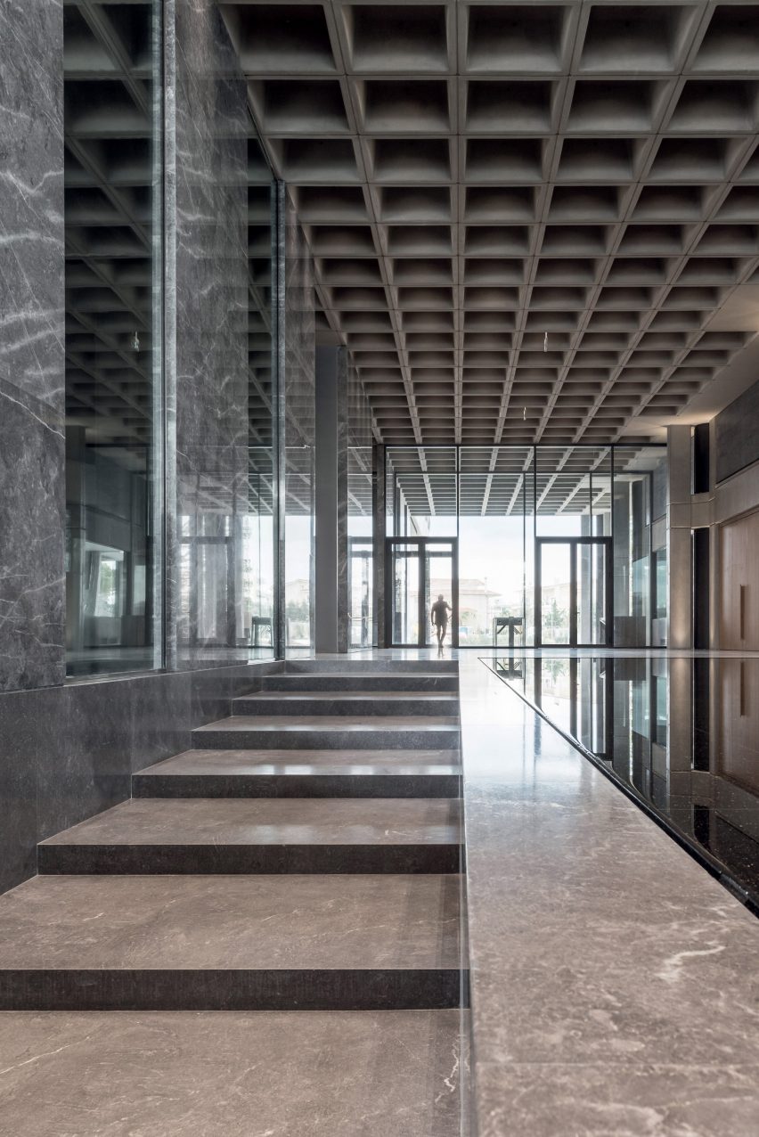 A marble-lined entrance to a Greek office