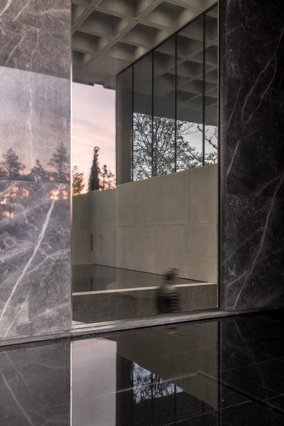 An office entrance lined with slabs of marble