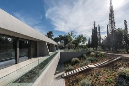 The brutalist facade of a Greek office
