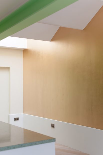 A residential kitchen with a saw-tooth roof