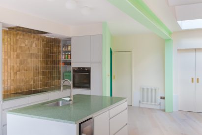 White kitchen with green-painted structure in London