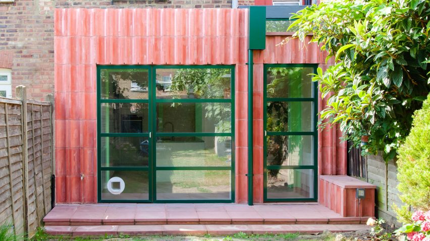 A kitchen extension clad in pink concrete