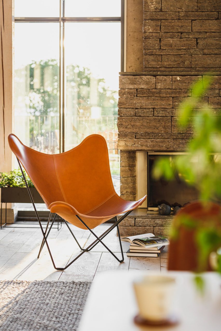 A butterfly chair made with brown leather