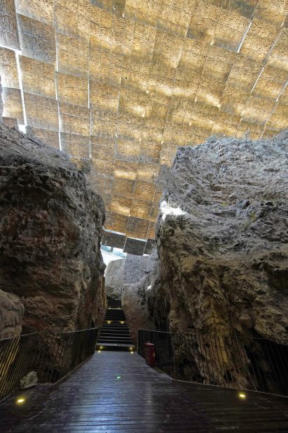 A wooden walkway through a cave