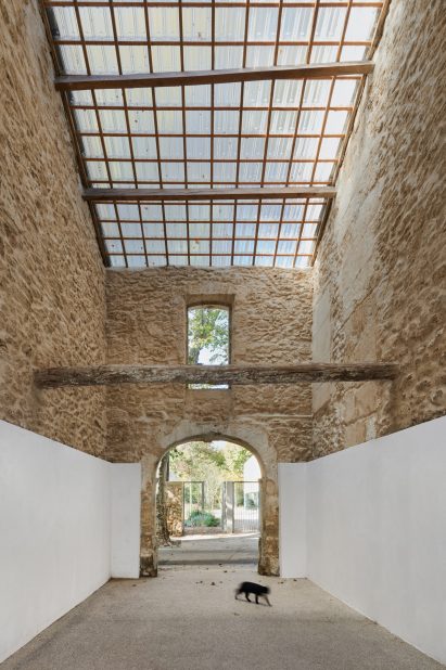 Original beams and stone are preserved in the passageway 