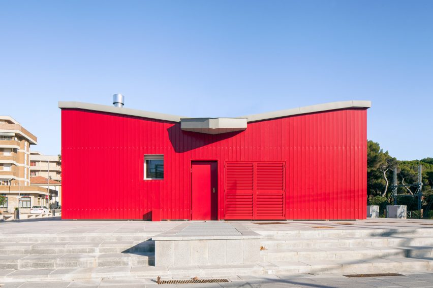 The red facade of a public pavilion