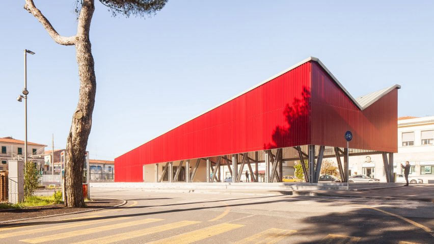 An angular red pavilion in the Piazza della Repubblica