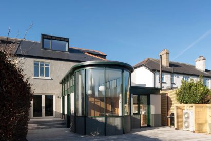 Curved glass extension on home by Scullion Architects