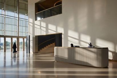 A pared-back and double-height reception area