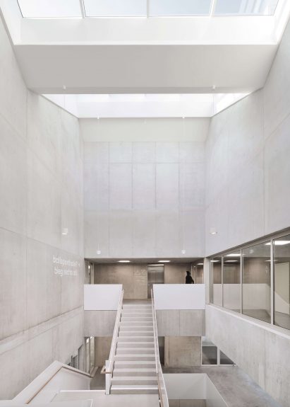 Raw concrete runs throughout the interior