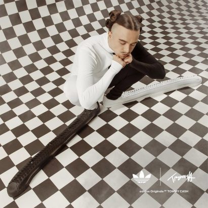 Tommy Cash wearing his bespoke Adidas Superstar trainers