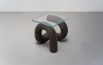 Ulu Table has a glass top