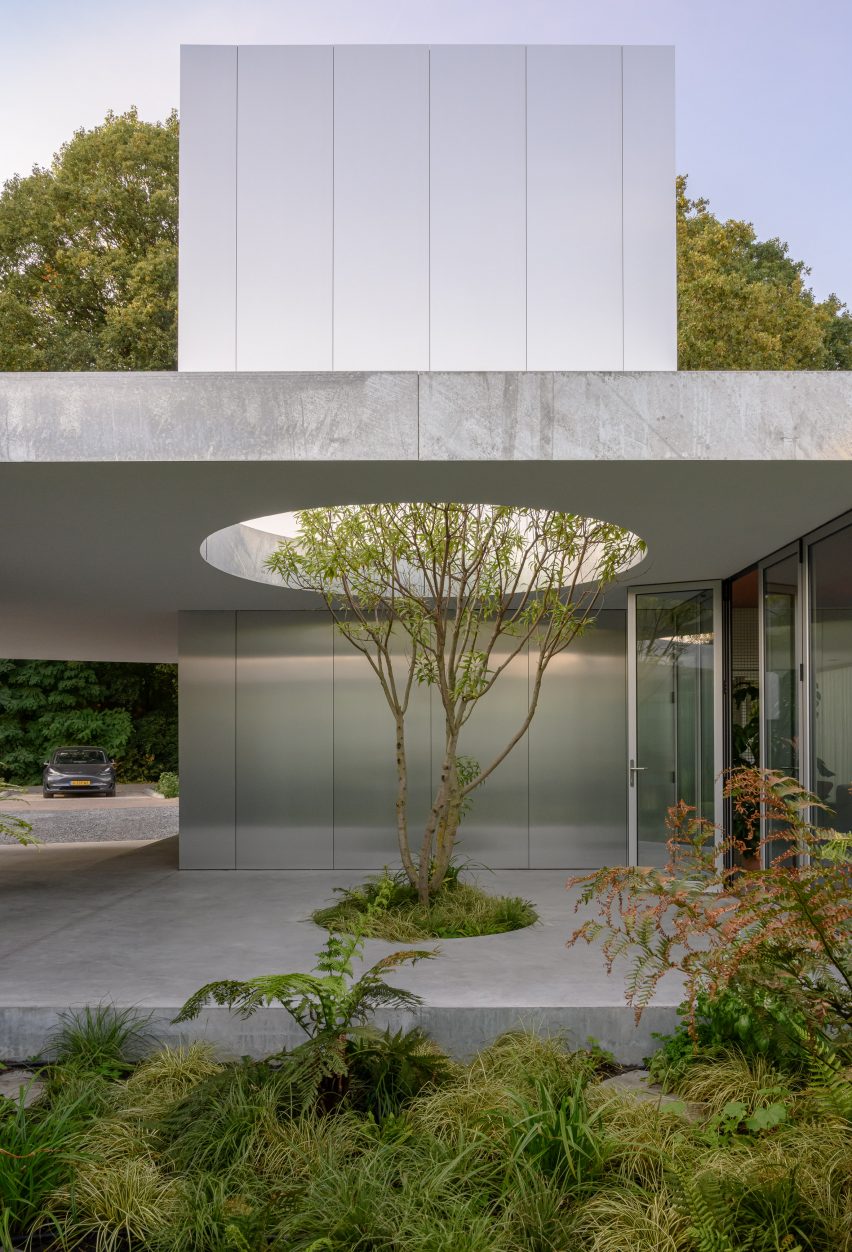 A courtyard lined with concrete and polished-metal