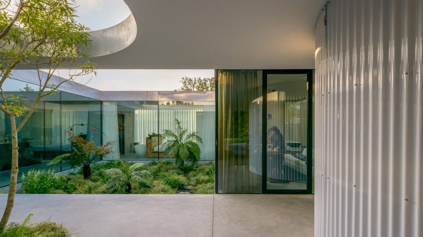 A sheltered courtyard within the industrial Villa Fifty-Fifty house